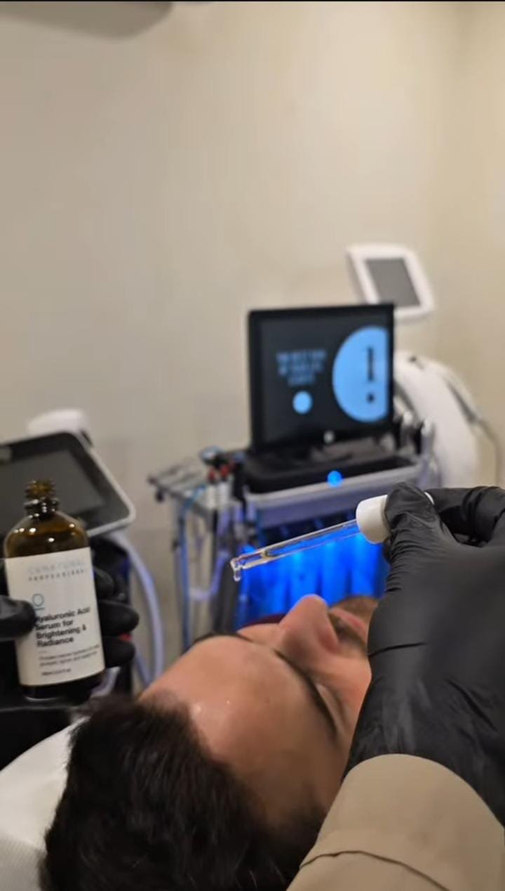 Serum being applied during a professional skincare treatment session